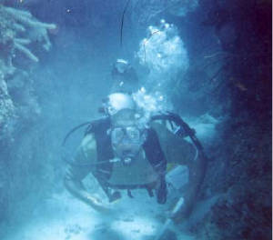 Anthony in tunnel, Little Cayman. Dive In Camea